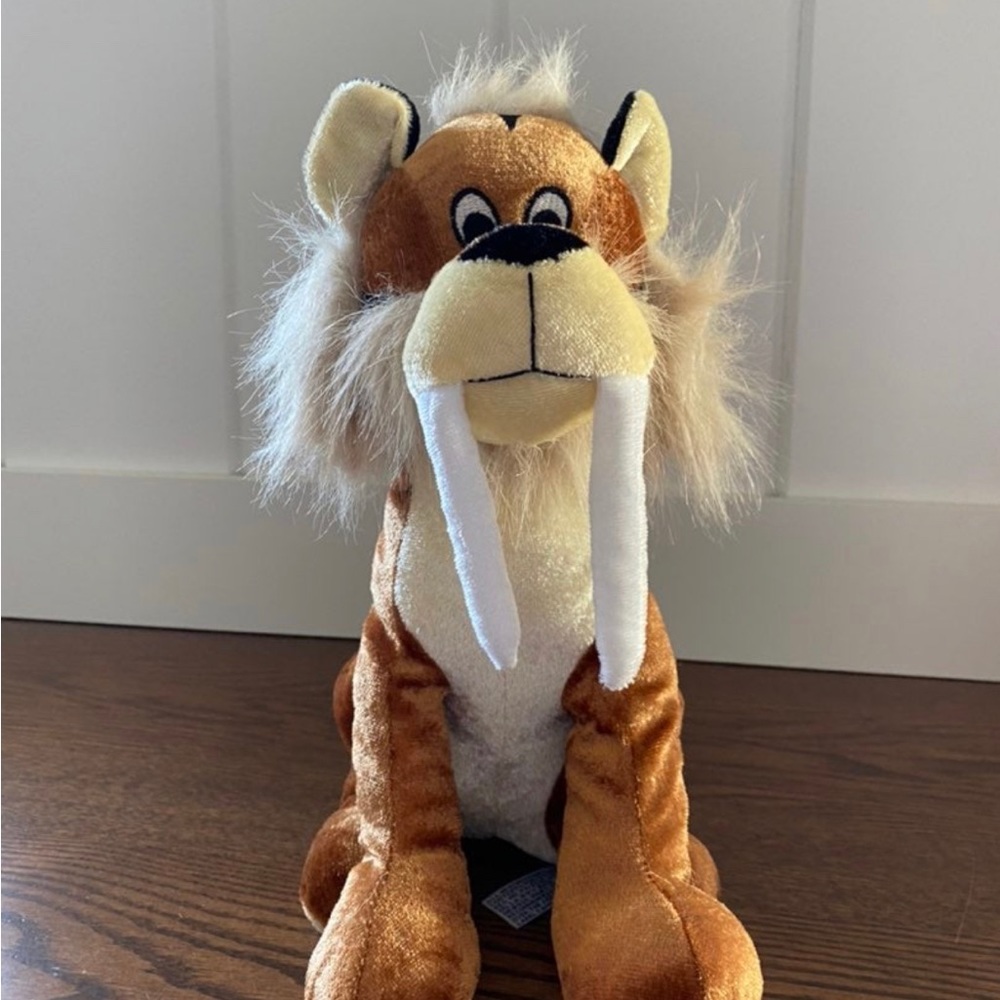 Saber tooth tiger Plush 10”
B.J. Toys